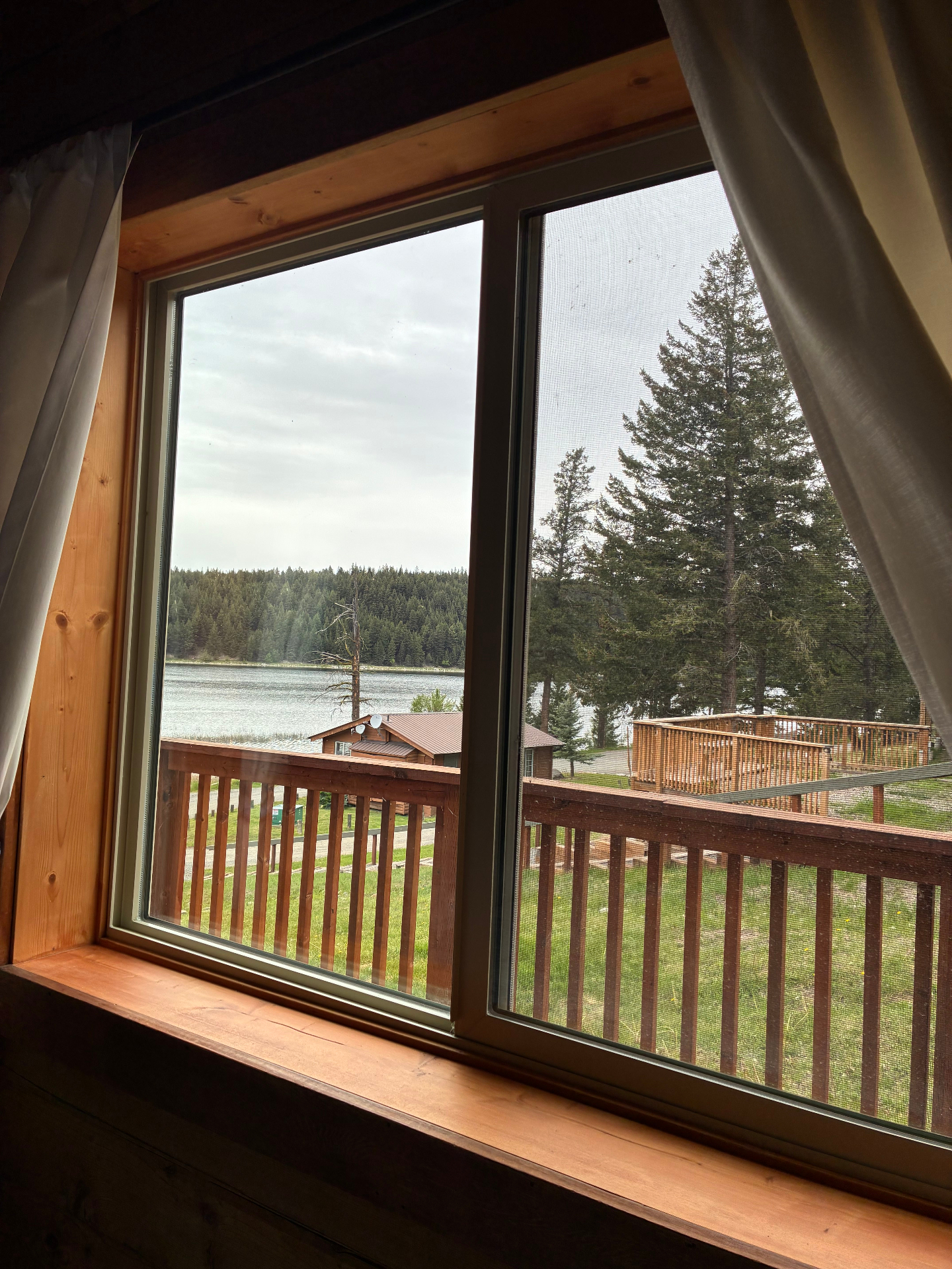 Interior lake view through the updated cabin window and trim