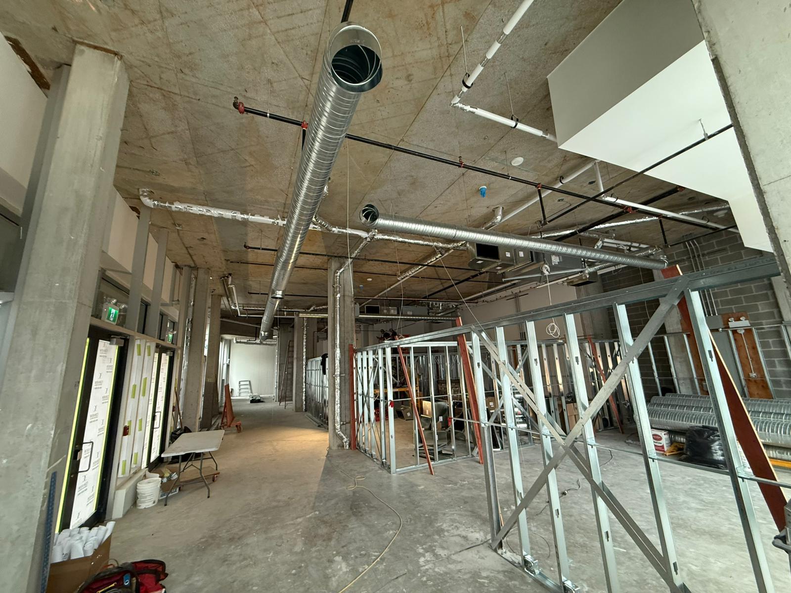 Sandbox VR Surrey tenant space during construction with overhead ducting and steel framing