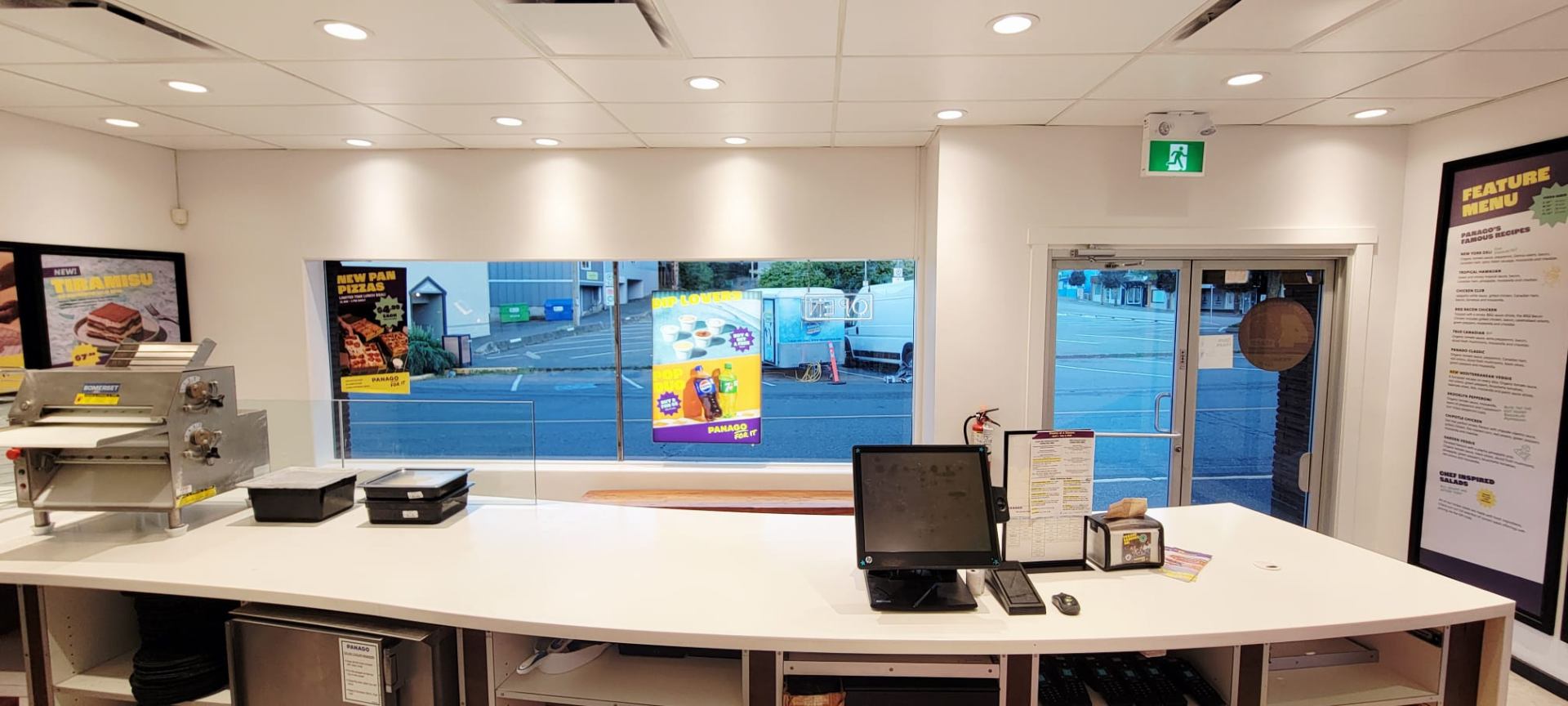Panago Courtenay prep counter with refreshed flooring, ceiling, and window line