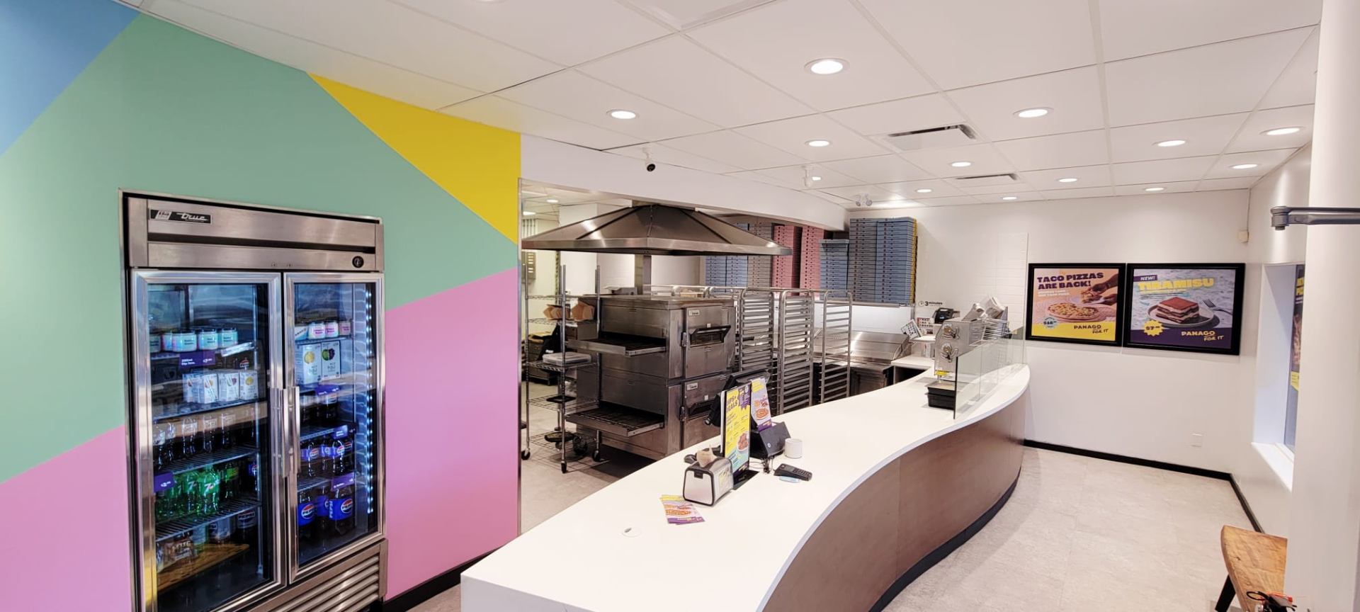 Panago Courtenay kitchen, ovens, and mural wall after refresh
