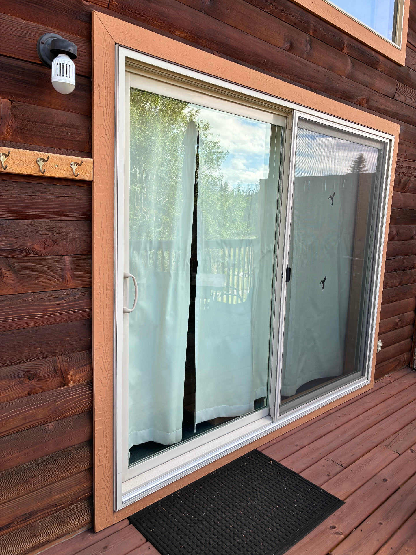 Exterior sliding door with updated trim on the cabin deck side