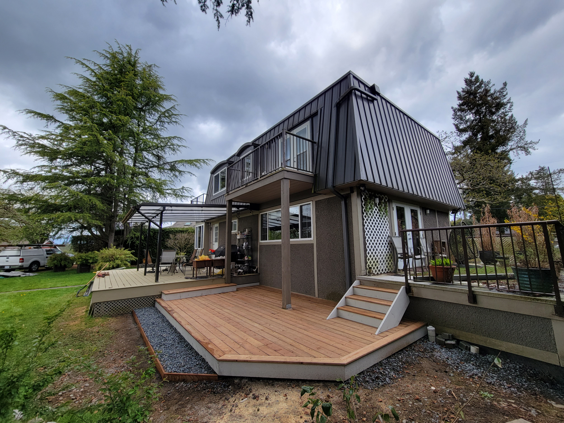 Completed cedar deck addition extending outdoor living area