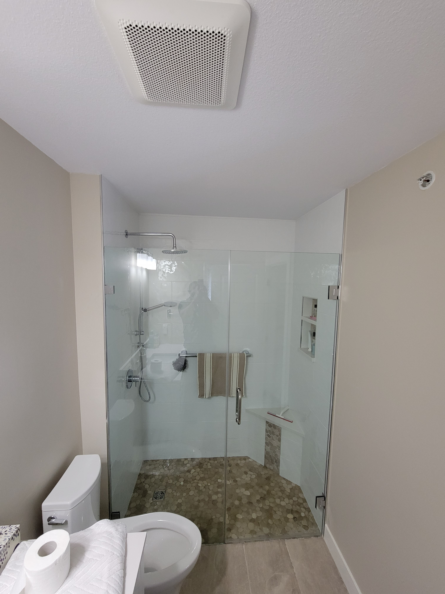 Finished glass shower enclosure with niche storage and bench seat