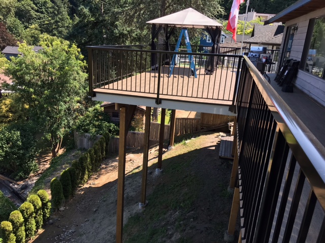 Elevated deck on new posts with gazebo and outdoor seating