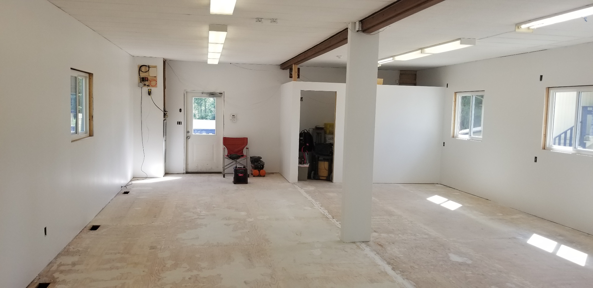 Drywall installed, layout taking shape